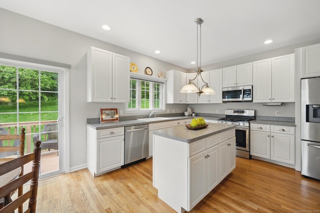 107 Chestnut Hill Rd Unit 107, Portland, CT 06480 - kitchen featuring appliances with stainless steel finishes, a sink, a kitchen island, white cabinets, and recessed lighting