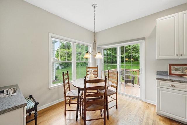 107 Chestnut Hill Rd Unit 107, Portland, CT 06480 - dining area with baseboards and light wood-style flooring