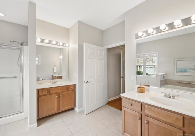 107 Chestnut Hill Rd Unit 107, Portland, CT 06480 - full bathroom featuring tile patterned floors, a shower stall, two vanities, a bath, and baseboards