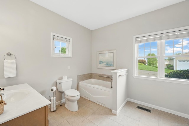107 Chestnut Hill Rd Unit 107, Portland, CT 06480 - full bathroom with baseboards, toilet, a garden tub, vanity, and tile patterned floors