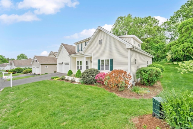 107 Chestnut Hill Rd Unit 107, Portland, CT 06480 - view of front of house featuring asphalt driveway, a front lawn, and a garage