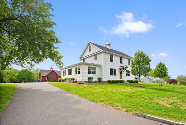 179 Mountain St, Ellington, CT 06029 - view of front of home with a front yard and a chimney