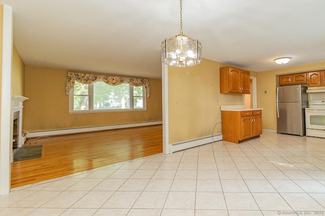 123 Jeffrey Ln, Newington, CT 06111 - kitchen with freestanding refrigerator, a baseboard radiator, electric range, and light countertops
