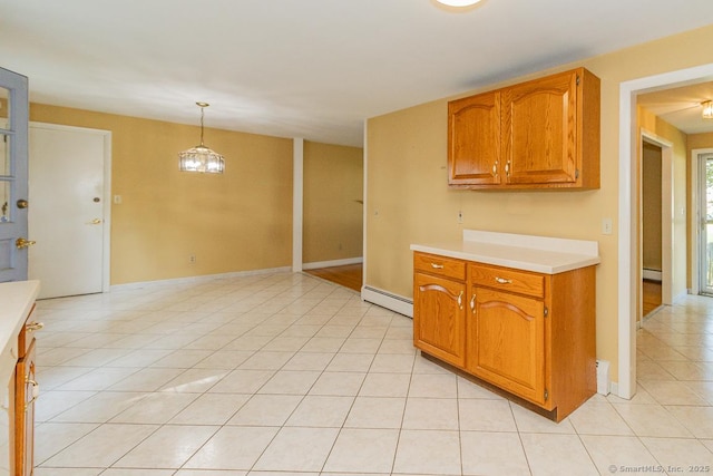 123 Jeffrey Ln, Newington, CT 06111 - kitchen featuring a baseboard heating unit, light countertops, light tile patterned floors, and hanging light fixtures