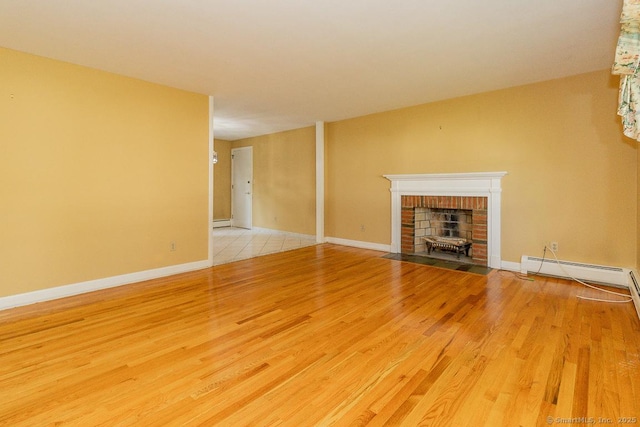 123 Jeffrey Ln, Newington, CT 06111 - unfurnished living room with wood finished floors, a brick fireplace, a baseboard radiator, and baseboards