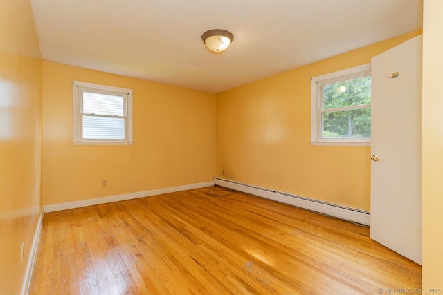 123 Jeffrey Ln, Newington, CT 06111 - spare room with baseboard heating, light wood-style floors, and baseboards