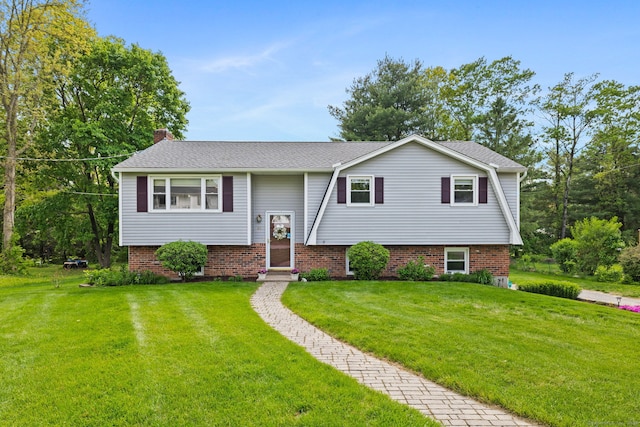48 Flom Dr, Colchester, CT 06415 - raised ranch with a front yard, a chimney, and a shingled roof