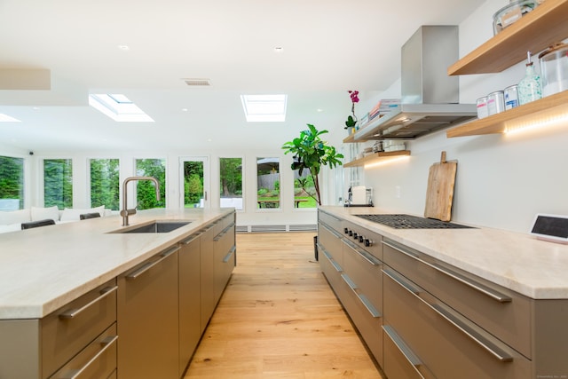 175 Riverside Ave, Greenwich, CT 06878 - kitchen with open shelves, a skylight, a sink, and island range hood