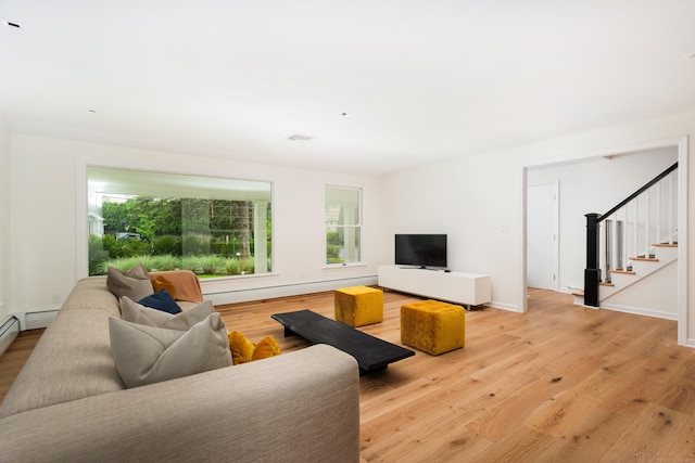 175 Riverside Ave, Greenwich, CT 06878 - living area featuring stairs, light wood-style flooring, and baseboards