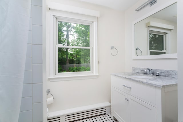 175 Riverside Ave, Greenwich, CT 06878 - full bathroom with a baseboard heating unit, vanity, and toilet