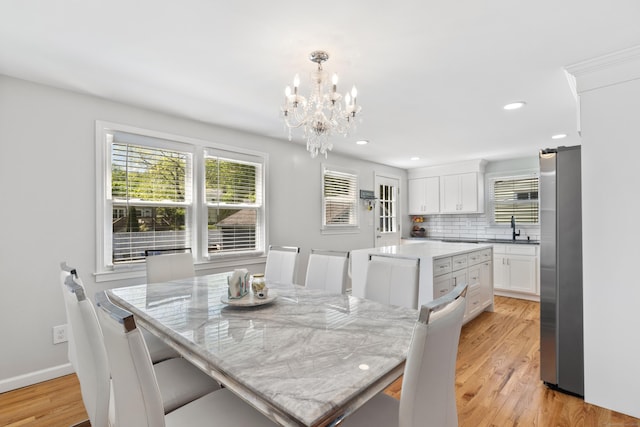 26 Carroll Rd, Hamden, CT 06517 - dining space with a chandelier, light wood finished floors, recessed lighting, and baseboards