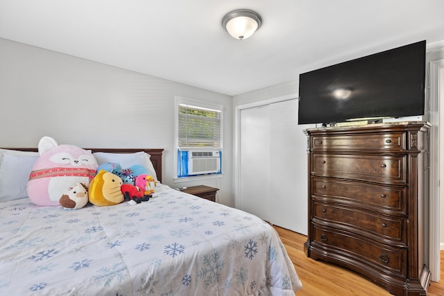 26 Carroll Rd, Hamden, CT 06517 - bedroom with light wood finished floors, a closet, and cooling unit