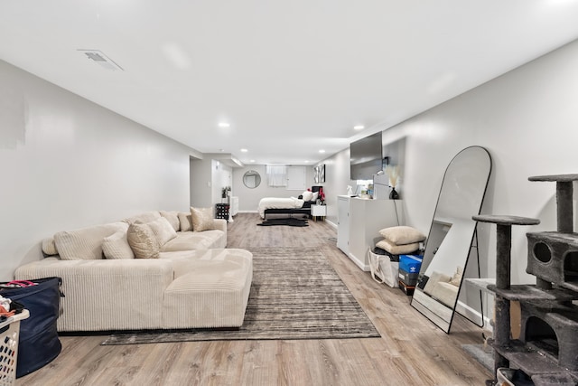26 Carroll Rd, Hamden, CT 06517 - living room featuring light wood-type flooring and recessed lighting