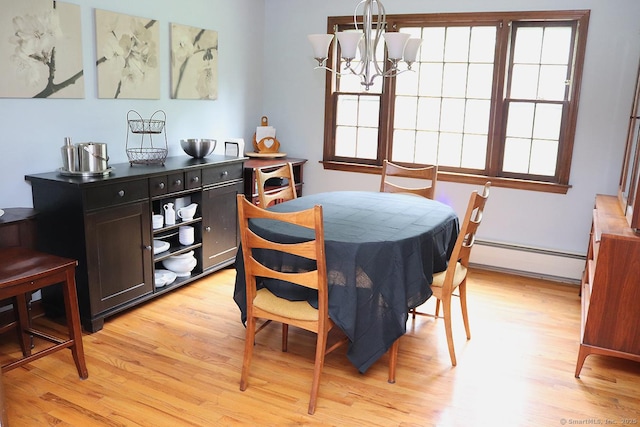 207 Pheasant Dr, Rocky Hill, CT 06067 - dining room featuring baseboard heating, light wood finished floors, and a chandelier