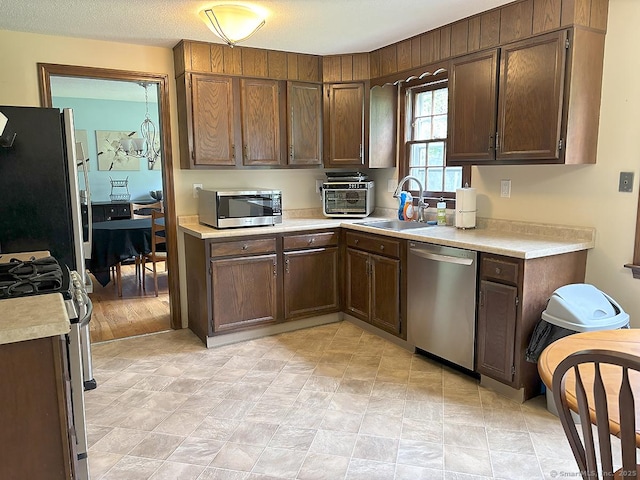 207 Pheasant Dr, Rocky Hill, CT 06067 - kitchen featuring appliances with stainless steel finishes, light countertops, and a sink