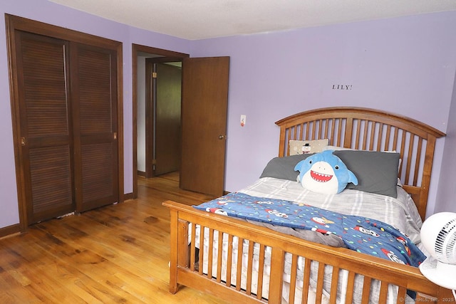 207 Pheasant Dr, Rocky Hill, CT 06067 - bedroom with wood finished floors, a closet, and baseboards