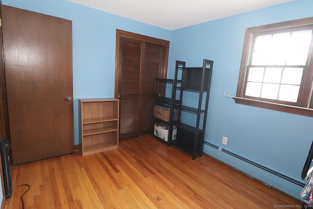 207 Pheasant Dr, Rocky Hill, CT 06067 - unfurnished bedroom with a baseboard heating unit and light wood-type flooring
