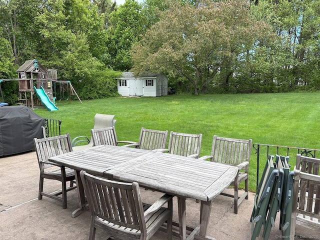 207 Pheasant Dr, Rocky Hill, CT 06067 - view of patio featuring outdoor dining space, a playground, area for grilling, and view of scattered trees