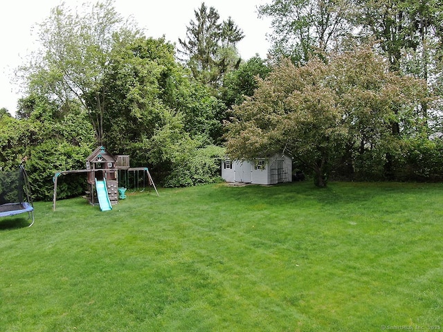 207 Pheasant Dr, Rocky Hill, CT 06067 - view of green lawn featuring a trampoline and a playground