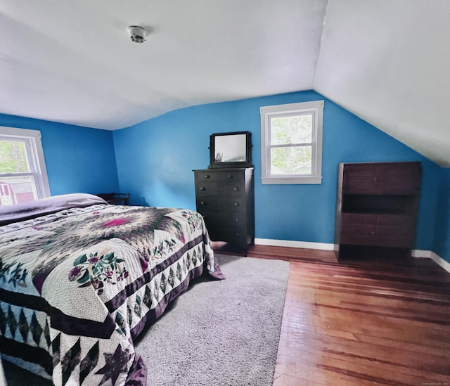 115 Stanton Ave, Winchester, CT 06098 - bedroom featuring multiple windows, baseboards, wood finished floors, and lofted ceiling