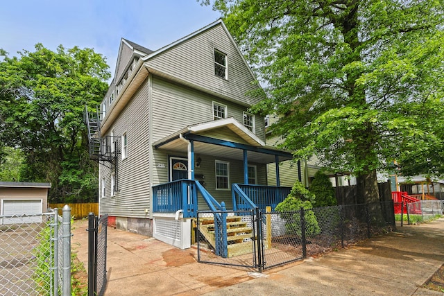 212 Newhall St, New Haven, CT 06511 - view of front of property with a porch, a gate, a fenced front yard, and driveway