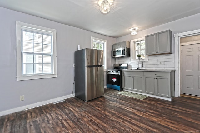 212 Newhall St, New Haven, CT 06511 - kitchen with stainless steel appliances, gray cabinetry, dark wood-type flooring, and baseboards