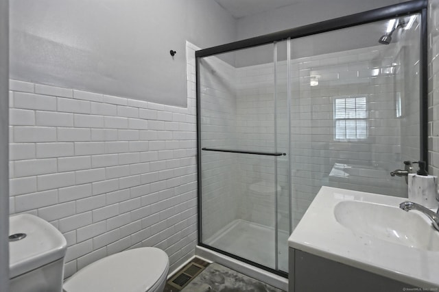 212 Newhall St, New Haven, CT 06511 - bathroom featuring tile walls, toilet, a stall shower, and vanity