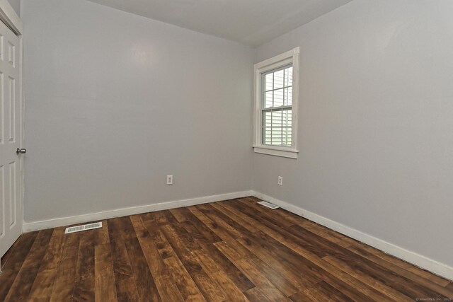 212 Newhall St, New Haven, CT 06511 - empty room with dark wood-type flooring and baseboards