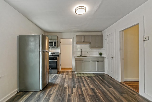 212 Newhall St, New Haven, CT 06511 - kitchen featuring appliances with stainless steel finishes, a sink, gray cabinetry, and backsplash