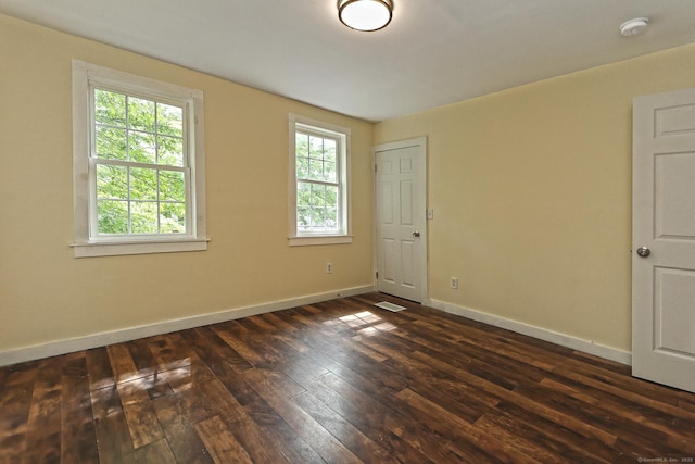 212 Newhall St, New Haven, CT 06511 - spare room featuring dark wood-type flooring, a smoke detector, and baseboards
