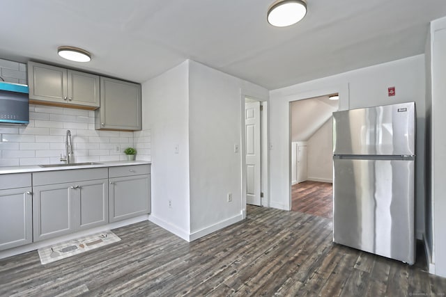 212 Newhall St, New Haven, CT 06511 - kitchen with freestanding refrigerator, gray cabinetry, a sink, and dark wood-style flooring