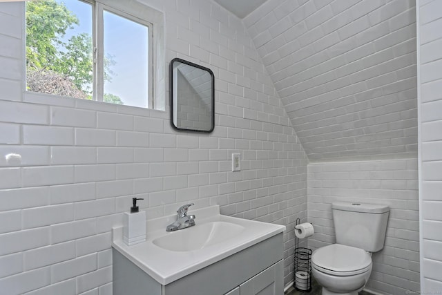 212 Newhall St, New Haven, CT 06511 - bathroom featuring tile walls, toilet, and vanity