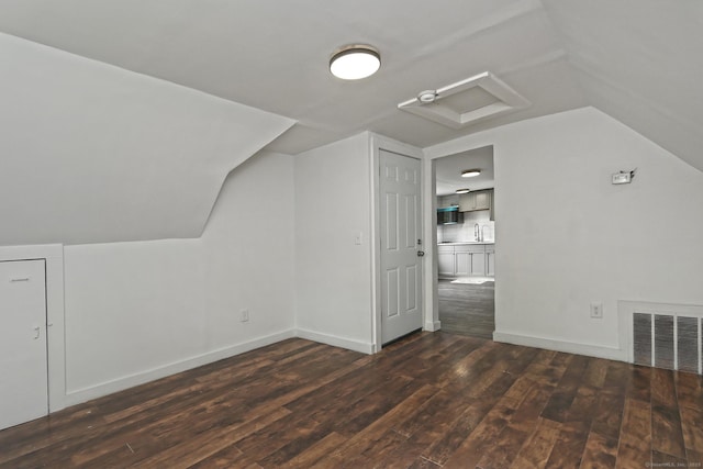 212 Newhall St, New Haven, CT 06511 - additional living space featuring wood finished floors, lofted ceiling, attic access, a sink, and baseboards