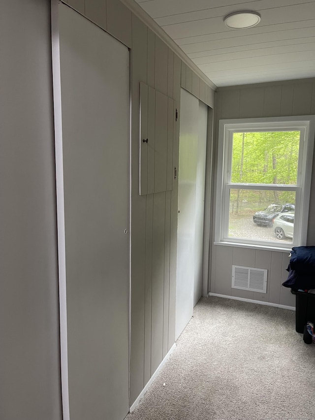 hall with carpet floors
