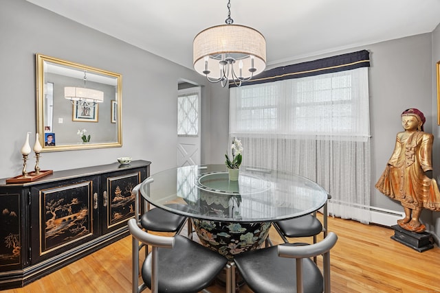 91 Parklawn Dr, Waterbury, CT 06708 - dining space with a chandelier, baseboard heating, and wood finished floors