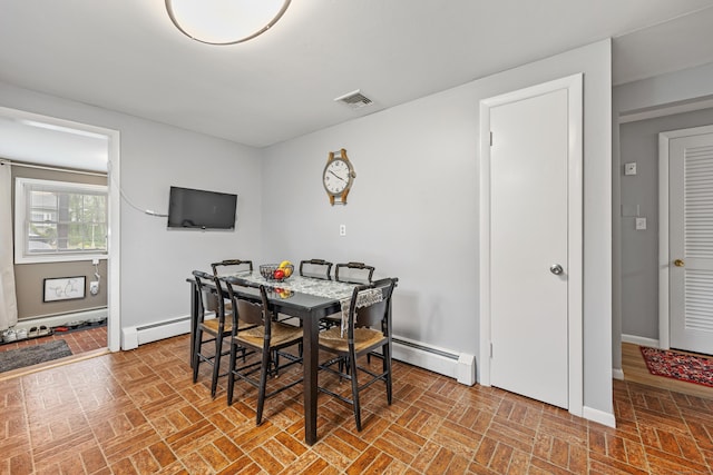 91 Parklawn Dr, Waterbury, CT 06708 - dining area featuring a baseboard heating unit, brick patterned floors, and baseboards