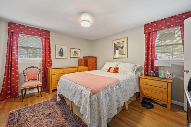 91 Parklawn Dr, Waterbury, CT 06708 - bedroom with multiple windows and wood finished floors