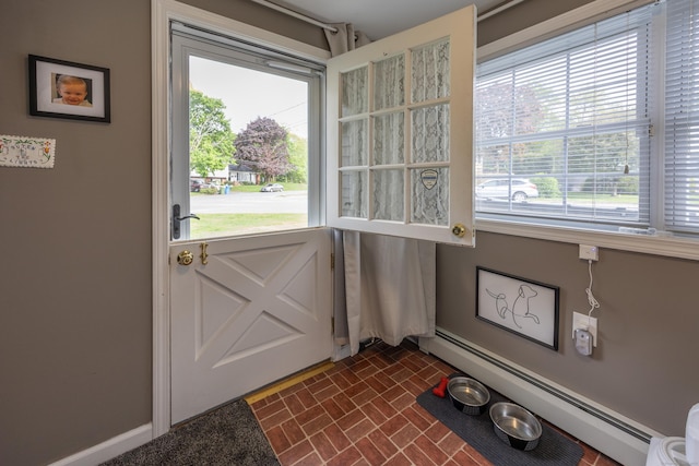 91 Parklawn Dr, Waterbury, CT 06708 - doorway featuring baseboard heating, brick patterned flooring, and baseboards