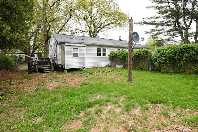 back of house with a wooden deck and fence