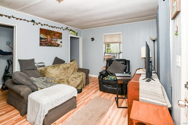 living room with ornamental molding, wood finished floors, and an office area
