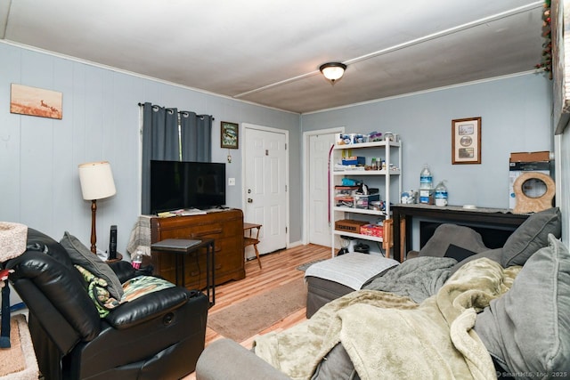 living room featuring wood finished floors and ornamental molding