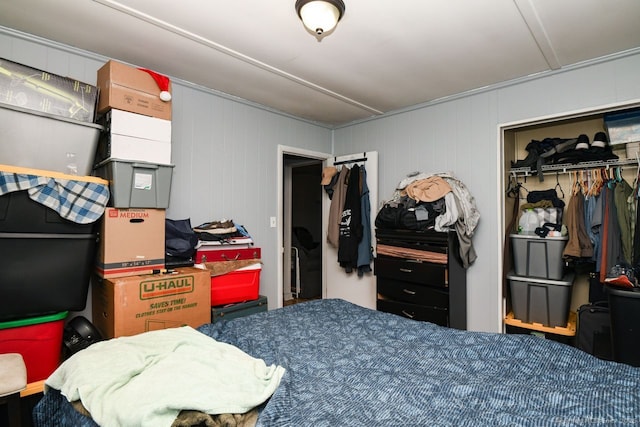 bedroom featuring attic access and a closet