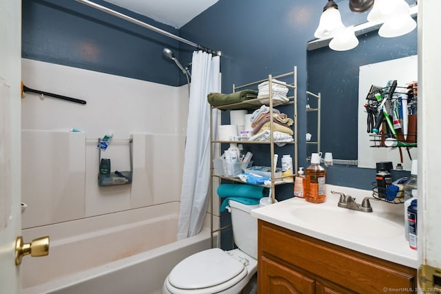 bathroom with vanity, shower / bath combo, and toilet