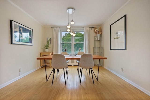 7 4th St Unit 1C, Stamford, CT 06905 - dining space featuring crown molding, light wood-type flooring, and baseboards