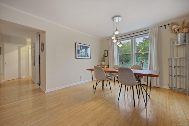 7 4th St Unit 1C, Stamford, CT 06905 - dining space with baseboards, light wood-style floors, and ornamental molding