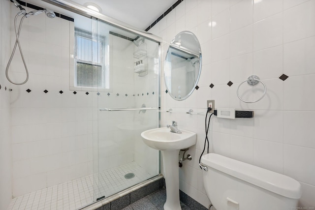 7 4th St Unit 1C, Stamford, CT 06905 - full bathroom with toilet, a shower stall, tile walls, and a sink