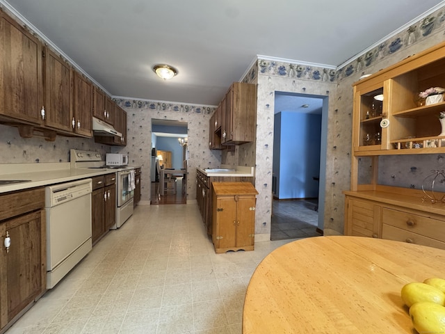 227 Twin Lakes Rd Apt C, North Branford, CT 06471 - kitchen with white appliances, wallpapered walls, under cabinet range hood, light countertops, and ornamental molding