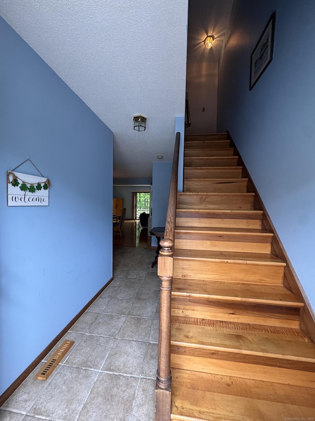 227 Twin Lakes Rd Apt C, North Branford, CT 06471 - staircase featuring baseboards