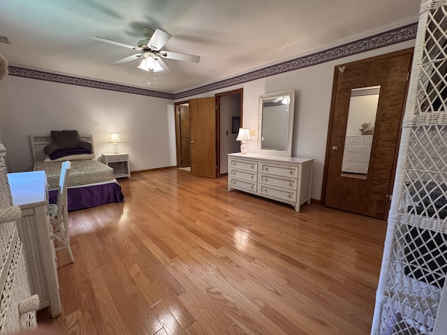 227 Twin Lakes Rd Apt C, North Branford, CT 06471 - bedroom with light wood-style floors, baseboards, ceiling fan, and ornamental molding
