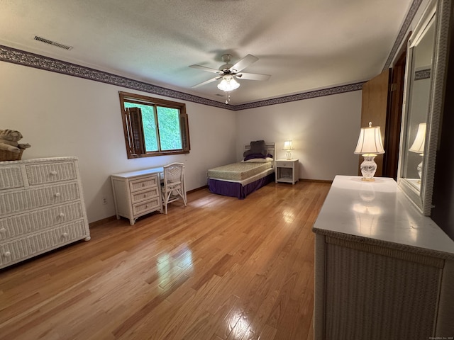 227 Twin Lakes Rd Apt C, North Branford, CT 06471 - bedroom with light wood-style flooring, baseboards, a ceiling fan, and ornamental molding